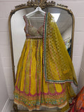 Mustard yellow printed lehenga set with embellished blouse and sequined net dupatta for weddings and festive occasions.