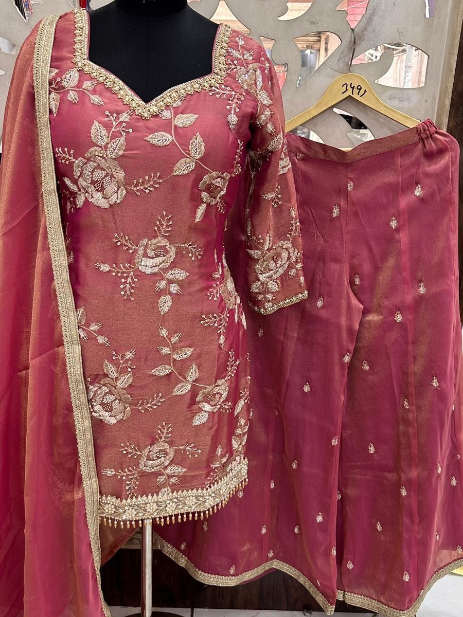 Rose pink embroidered Punjabi suit with floral embroidery, straight pants, and matching organza dupatta for weddings and festive occasions.